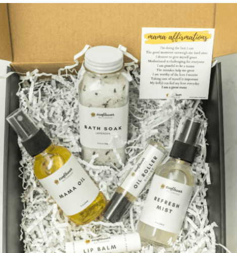 Self-care gift box for moms with bath salts and skincare items.